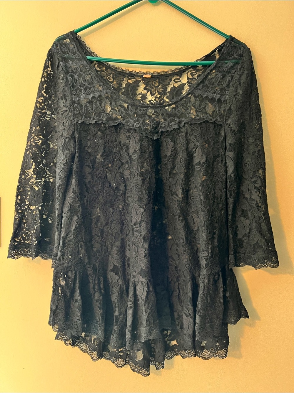 Free People black lace scoop neck peplum top, 3/4 sleeves, flouncy peplum hem.